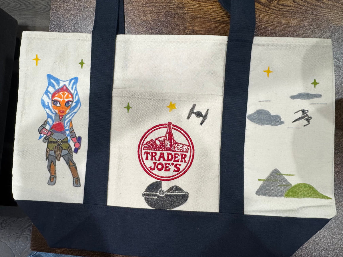 Back of Space Friends hand painted tote with a Togruta warrior, starfighters, and misty mountains