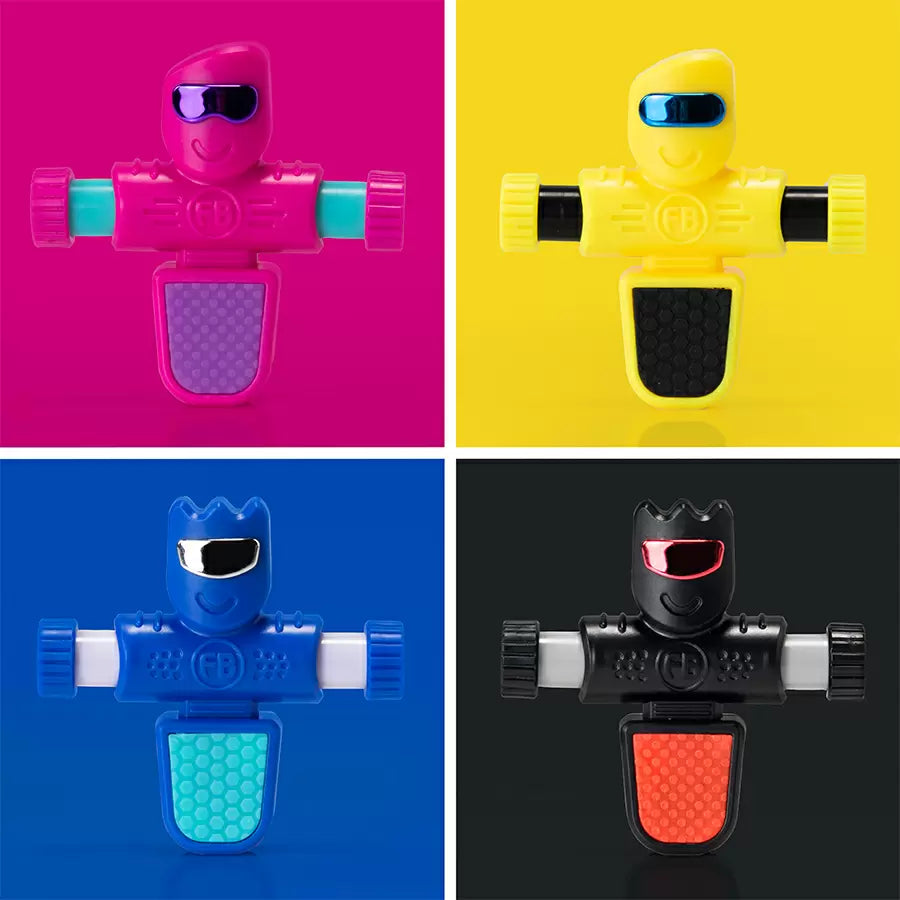 Four colorful robot-looking objects. One in magenta, one in yellow, one in blue, and one in black. Each robot has a head, two ams, and a larger "peg" for a leg.